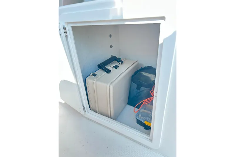 Slide: The Image of Storage compartment in 2020 Maritime 23 Challenger boat with equipment and gear. - 18