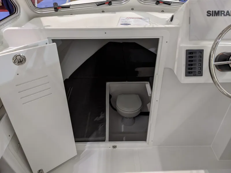 Slide: The Image of 2020 Maritime 23 Challenger boat interior with compact cabin toilet. - 7
