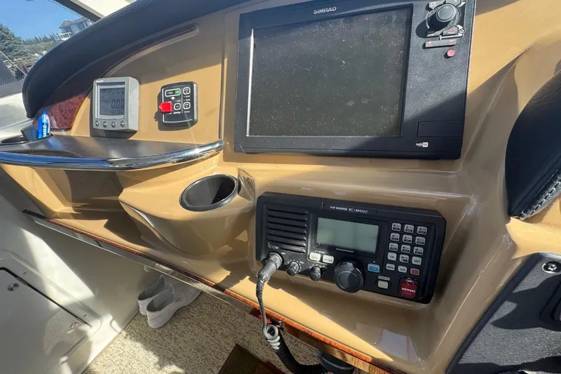 Slide: The Image of Control panel of 2004 Carver 564 Cockpit Motor Yacht with navigation and communication equipment. - 20