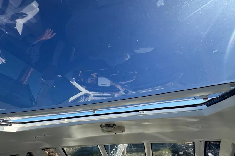 Slide: The Image of Interior view of 2004 Carver 564 Cockpit Motor Yacht with sunroof. - 28