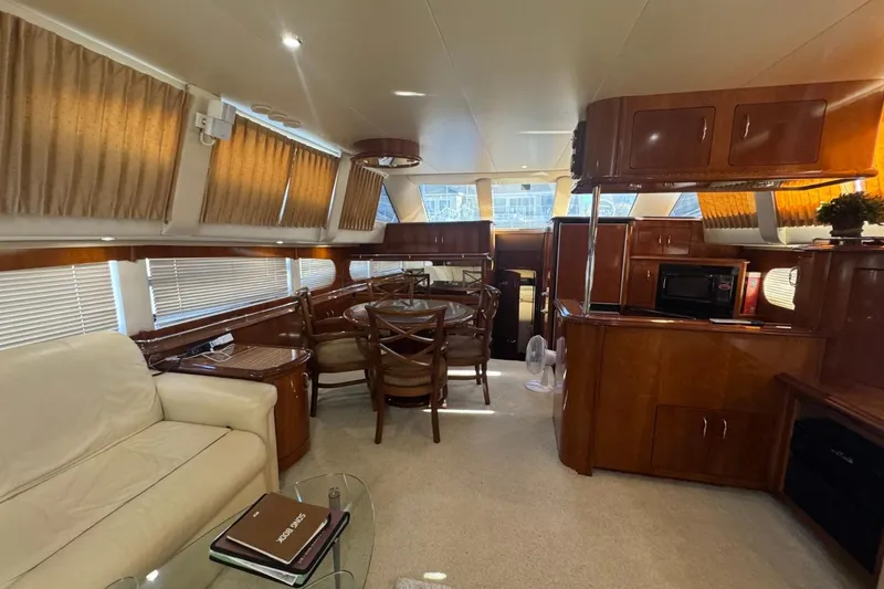 Slide: The Image of Luxurious interior of 2004 Carver 564 Cockpit Motor Yacht with elegant wood finishes. - 31