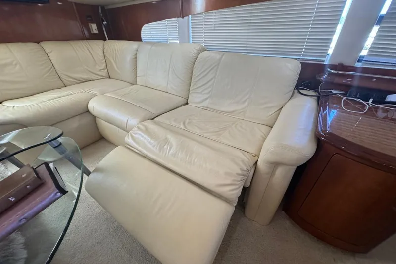 Slide: The Image of Luxurious interior of 2004 Carver 564 Cockpit Motor Yacht with cream leather seating. - 37