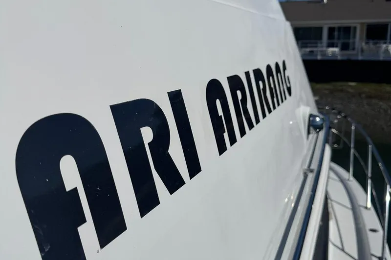 Slide: The Image of 2004 Carver 564 Cockpit Motor Yacht with "ARI ARIRANG" lettering on the side. - 5