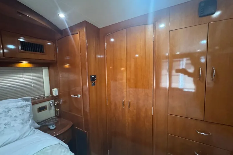 Slide: The Image of Luxurious wood-paneled interior of 2004 Carver 564 Cockpit Motor Yacht cabin. - 55
