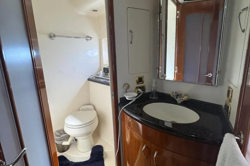 Slide: The Image of Luxurious bathroom in 2004 Carver 564 Cockpit Motor Yacht with modern fixtures. - 56