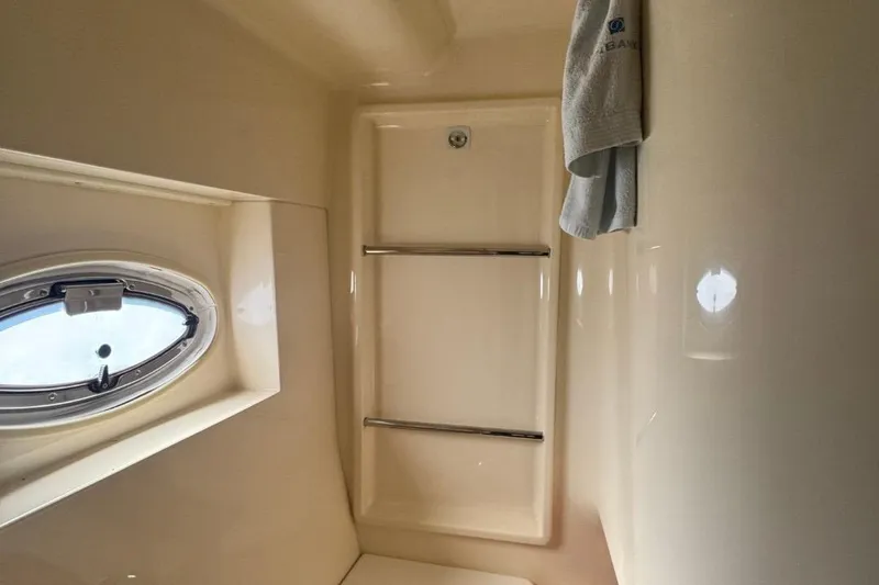 Slide: The Image of Bathroom interior of 2004 Carver 564 Cockpit Motor Yacht with porthole window. - 58