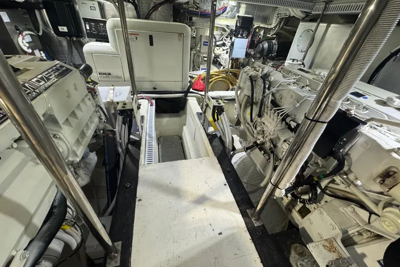 Slide: The Image of Engine room of 2004 Carver 564 Cockpit Motor Yacht with Kohler power systems. - 61