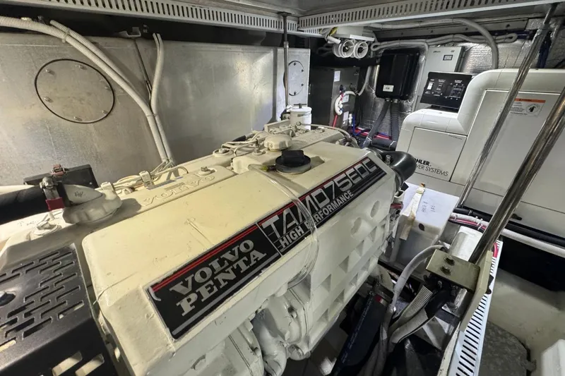 Slide: The Image of Engine room of 2004 Carver 564 Cockpit Motor Yacht with Volvo Penta engine. - 62