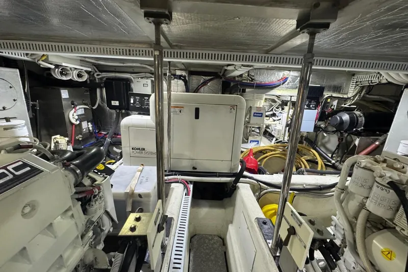 Slide: The Image of Engine room of 2004 Carver 564 Cockpit Motor Yacht with Kohler power system. - 63