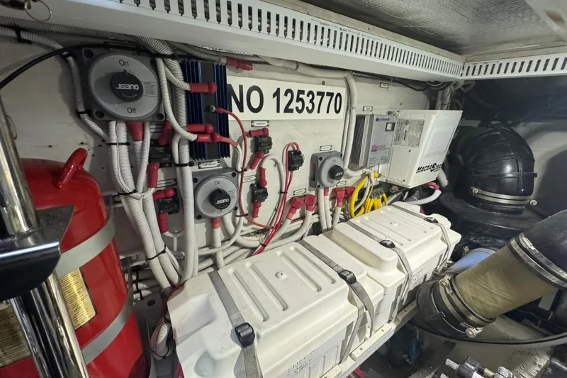 Slide: The Image of Engine room of 2004 Carver 564 Cockpit Motor Yacht with wiring and equipment. - 67