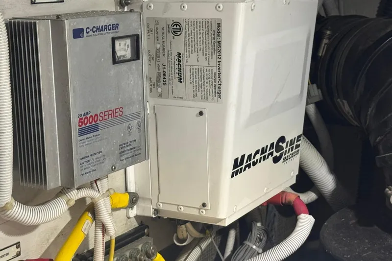 Slide: The Image of Electrical components in a 2004 Carver 564 Cockpit Motor Yacht engine room. - 68