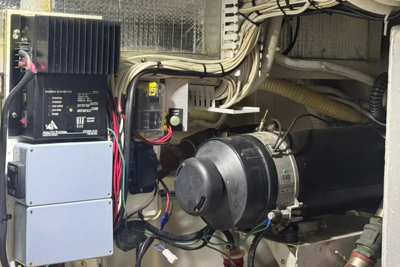 Slide: The Image of Engine room of 2004 Carver 564 Cockpit Motor Yacht with electrical components and wiring. - 69