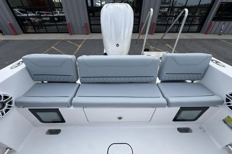 Slide: The Image of 2026 Sportsman Heritage 231 Center Console boat with gray seating and modern design. - 11
