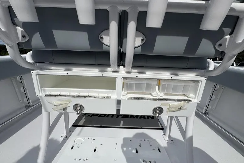 Slide: The Image of 2026 Sportsman Heritage 231 Center Console boat interior with storage compartments and seating. - 12