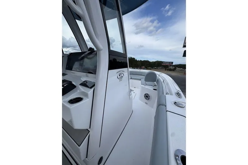 Slide: The Image of 2026 Sportsman Heritage 231 Center Console boat, showcasing sleek design and modern features. - 13