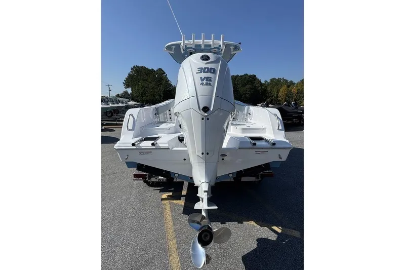 Slide: The Image of 2026 Sportsman Heritage 231 Center Console boat with Yamaha outboard motor on trailer. - 2