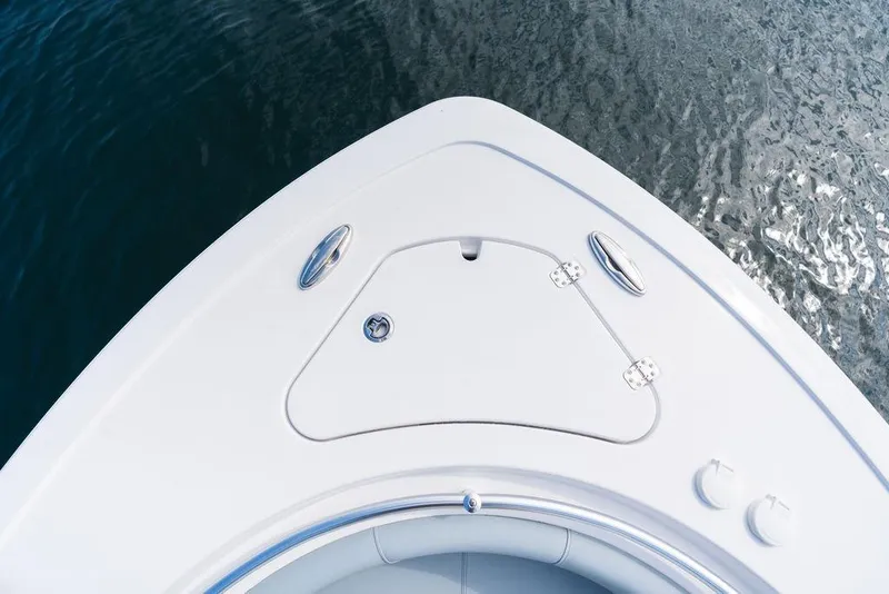 Slide: The Image of 2026 Sportsman Heritage 231 Center Console boat bow on water. - 25