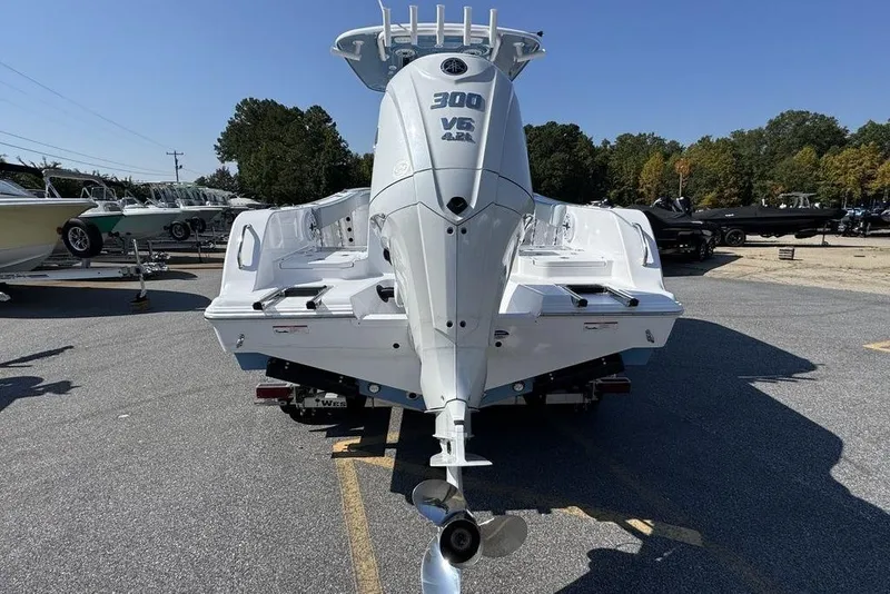 Slide: The Image of 2026 Sportsman Heritage 231 Center Console boat on trailer in parking lot. - 3