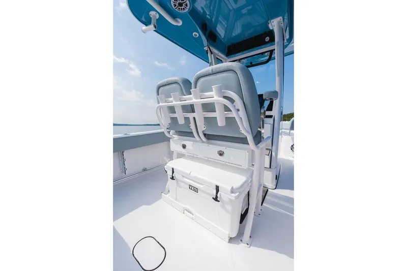 Slide: The Image of 2026 Sportsman Heritage 231 Center Console boat interior with seating and storage. - 34