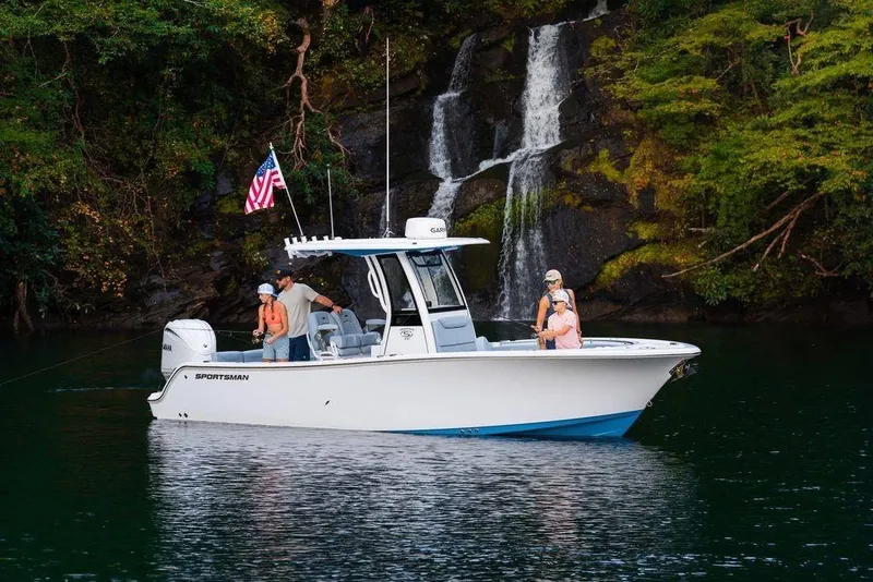 Slide: The Image of 2026 Sportsman Heritage 231 Center Console boat near waterfall, with people fishing. - 39