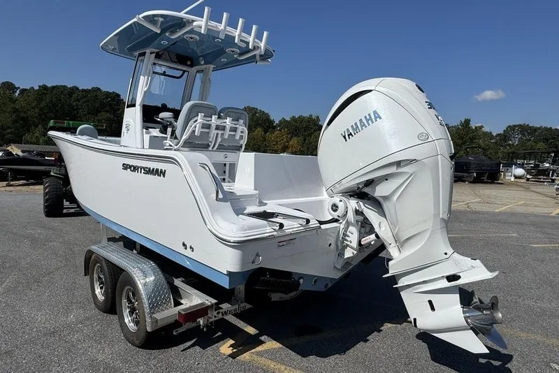Slide: The Image of 2026 Sportsman Heritage 231 Center Console boat on trailer in parking lot. - 4