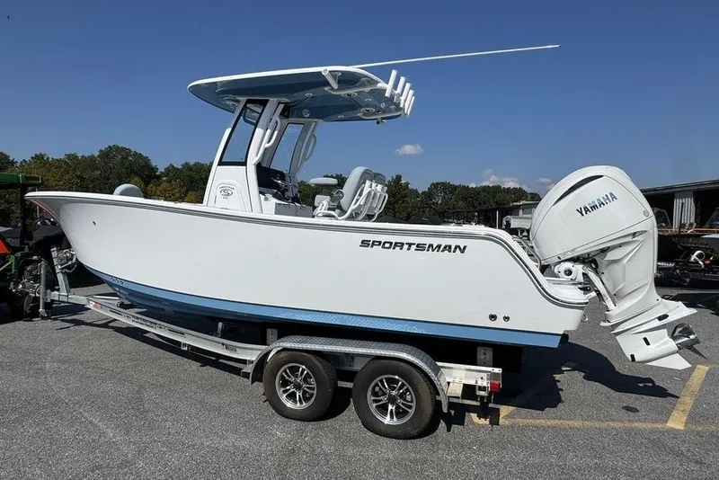 Slide: The Image of 2026 Sportsman Heritage 231 Center Console boat on trailer in parking lot. - 5