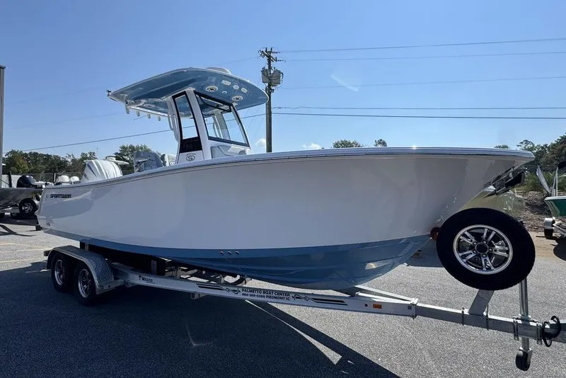 Slide: The Image of 2026 Sportsman Heritage 231 Center Console boat with gray cushioned seating. - 7