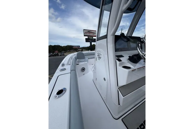 Slide: The Image of 2026 Sportsman Heritage 231 Center Console boat with modern seating and sleek design. - 9