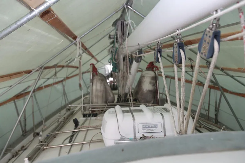 Slide: The Image of Covered deck of a 2004 Pacific Seacraft 40 sailboat with rigging and equipment. - 103