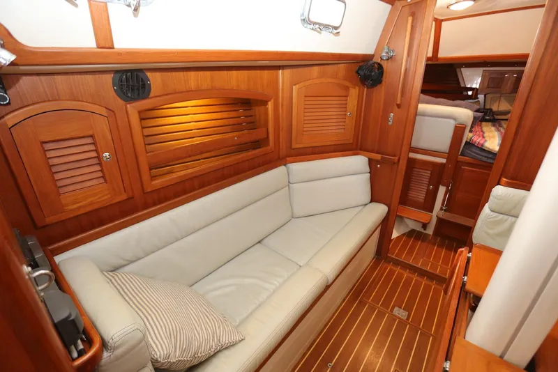 Slide: The Image of Luxurious interior of 2004 Pacific Seacraft 40 sailboat with wooden finish and cozy seating. - 18