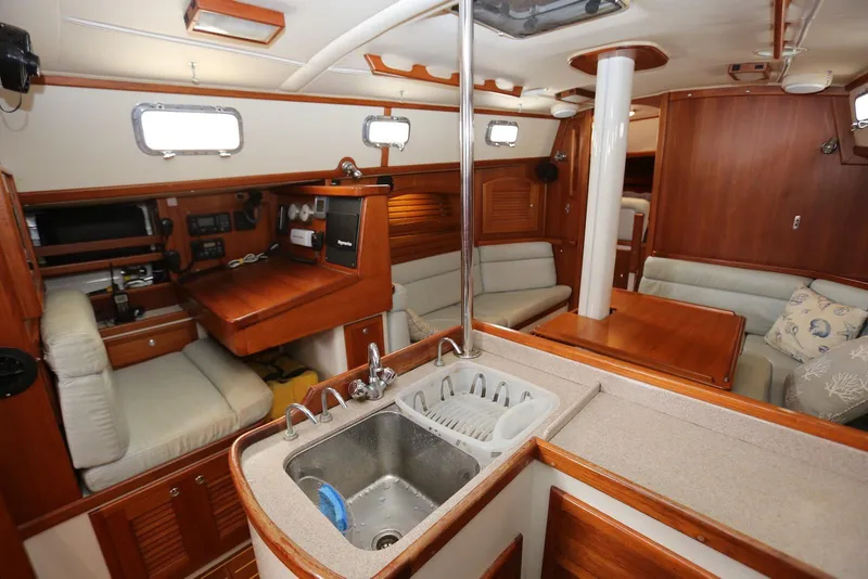 Slide: The Image of Interior of 2004 Pacific Seacraft 40 sailboat with cozy seating and kitchen area. - 28