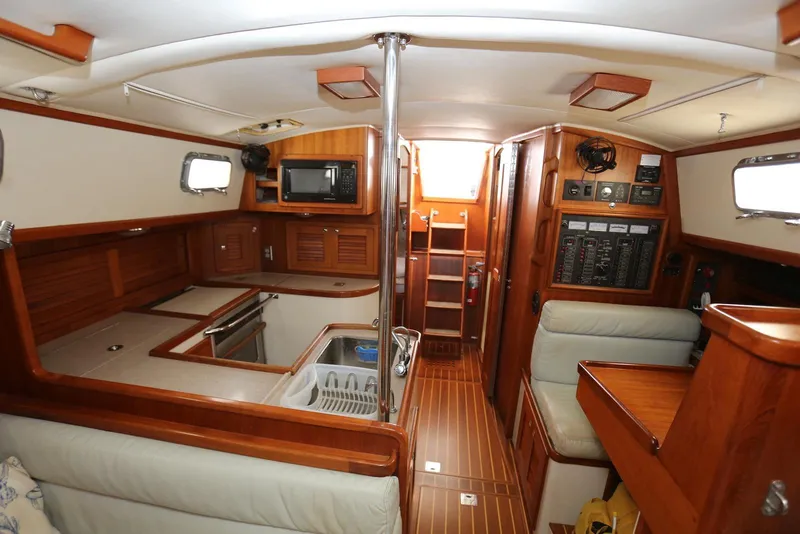 Slide: The Image of Interior of 2004 Pacific Seacraft 40 sailboat, featuring wood finishes and modern amenities. - 34