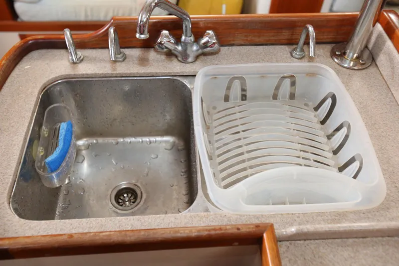 Slide: The Image of Galley sink and dish rack in 2004 Pacific Seacraft 40 yacht kitchen. - 42