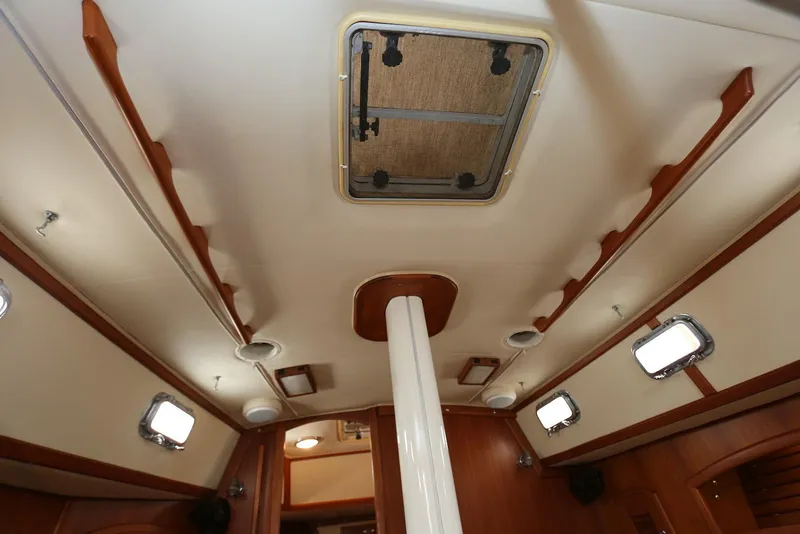 Slide: The Image of Interior view of 2004 Pacific Seacraft 40 sailboat cabin ceiling with portholes. - 49