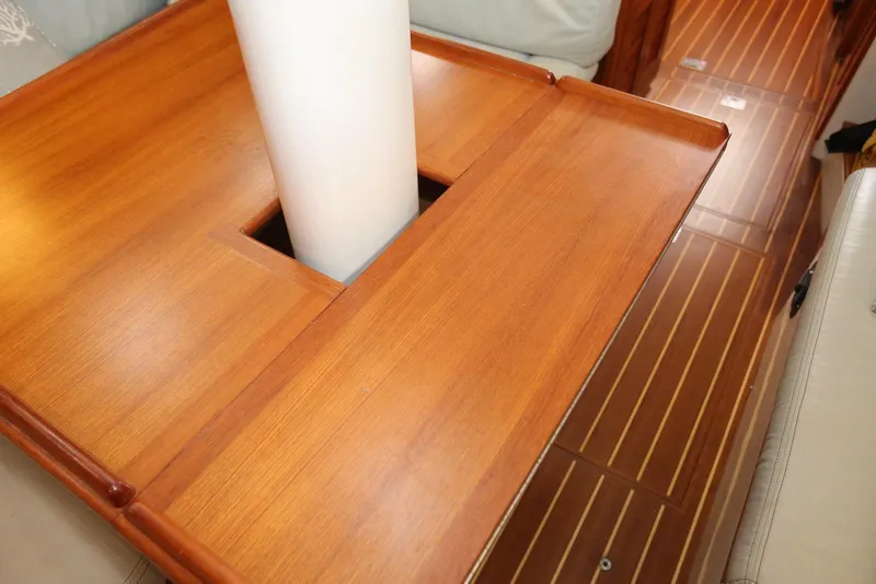 Slide: The Image of Interior of 2004 Pacific Seacraft 40 sailboat with wooden table and mast. - 51