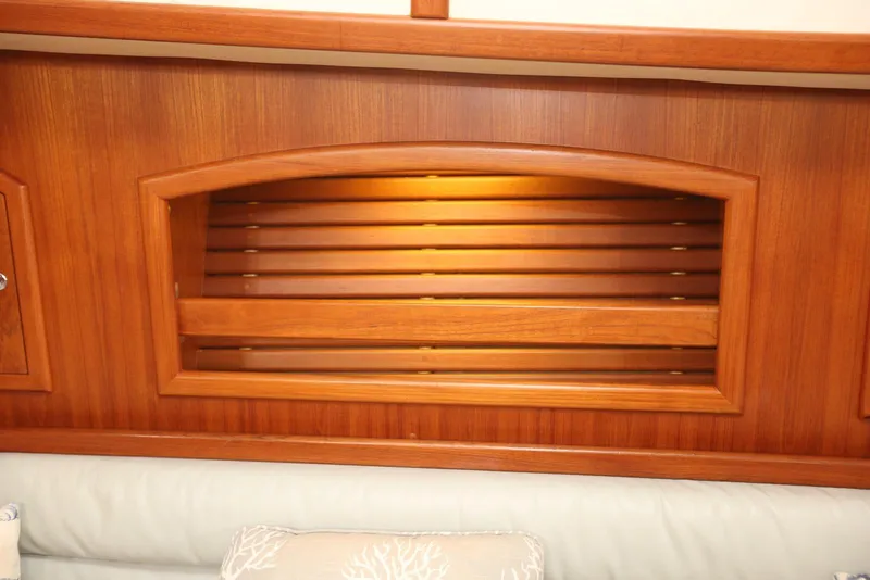 Slide: The Image of Wooden interior detail of 2004 Pacific Seacraft 40 sailboat, featuring a louvered cabinet. - 53