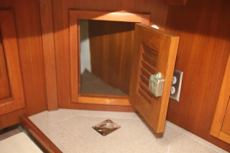 Slide: The Image of Wooden cabinet interior on a 2004 Pacific Seacraft 40 sailboat. - 57