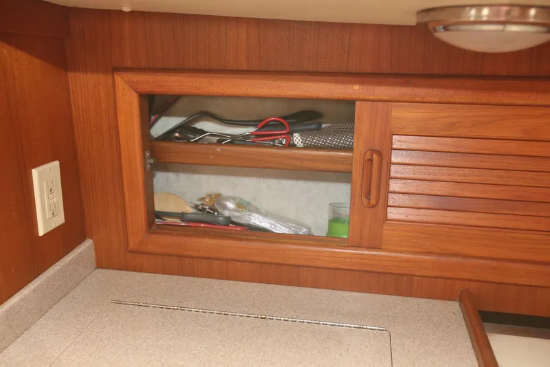 Slide: The Image of Wooden cabinet with sliding door in 2004 Pacific Seacraft 40 yacht interior. - 59