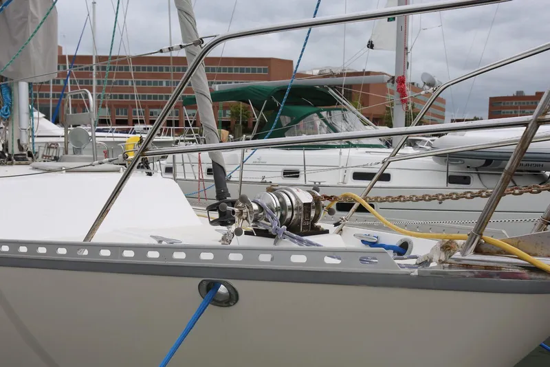 Slide: The Image of 2004 Pacific Seacraft 40 sailboat docked, featuring deck equipment and rigging. - 6