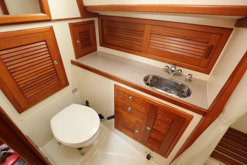Slide: The Image of Luxurious 2004 Pacific Seacraft 40 yacht bathroom with wooden cabinets and modern fixtures. - 60