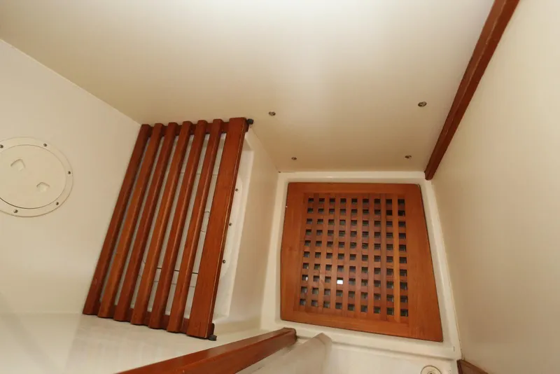 Slide: The Image of Interior view of 2004 Pacific Seacraft 40 sailboat with wooden lattice and paneling. - 64