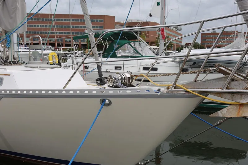 Slide: The Image of 2004 Pacific Seacraft 40 sailboat docked at marina, featuring anchor and rigging. - 7