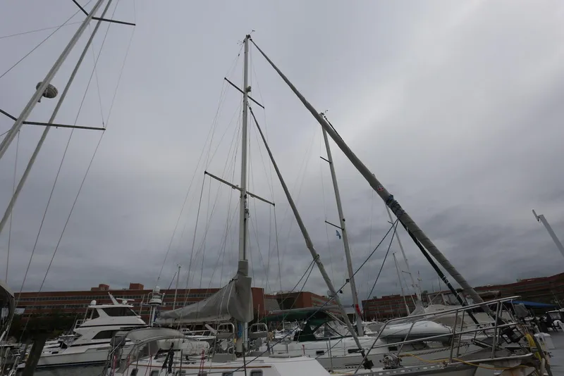 Slide: The Image of Sailboats docked at a marina under overcast skies, featuring a 2004 Pacific Seacraft 40. - 8