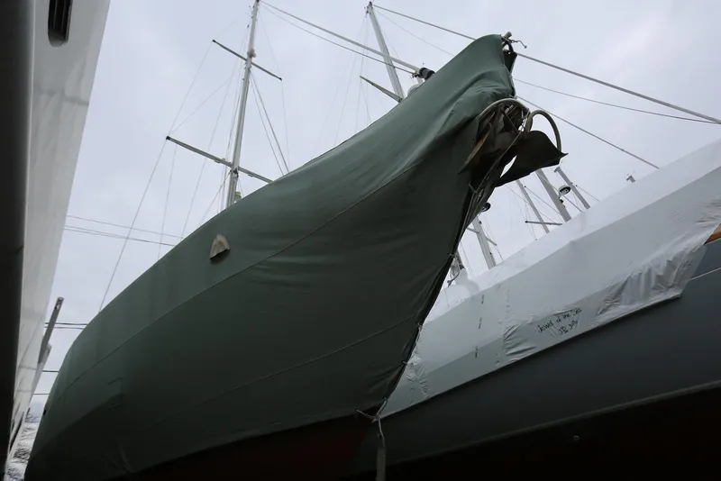 Slide: The Image of Covered Pacific Seacraft 40 sailboat from 2004, docked with masts visible. - 87