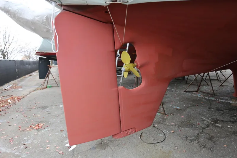 Slide: The Image of Pacific Seacraft 40 sailboat (2004) with visible rudder and propeller, on dry dock. - 93