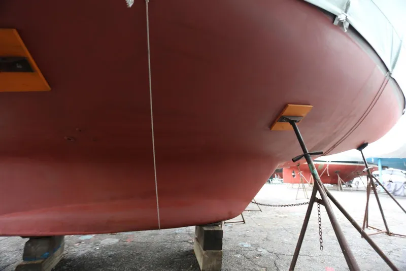 Slide: The Image of Bottom view of a 2004 Pacific Seacraft 40 sailboat on stands in a boatyard. - 96