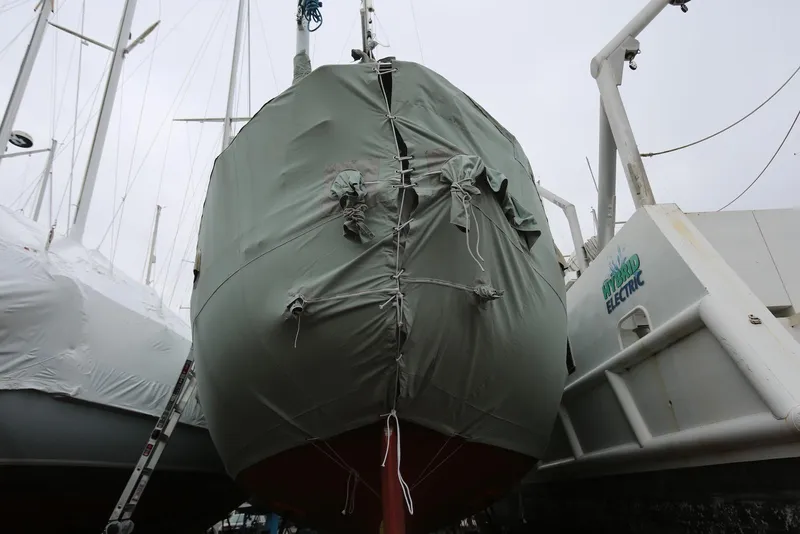 Slide: The Image of Covered 2004 Pacific Seacraft 40 sailboat in a marina, prepared for storage. - 98