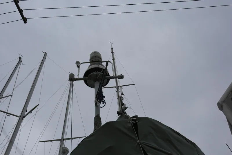 Slide: The Image of Mast of 2004 Pacific Seacraft 40 sailboat against cloudy sky. - 99