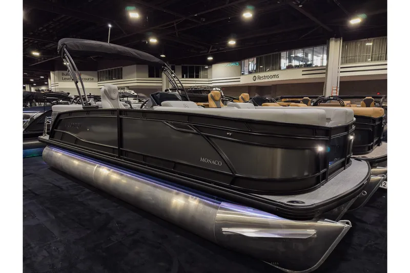 The Image of 2026 Godfrey Monaco 235 Ultra Lounge pontoon boat displayed indoors. - 0