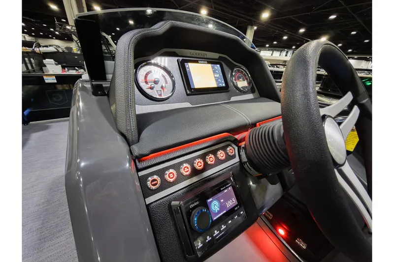 Slide: The Image of 2026 Godfrey Monaco 235 Ultra Lounge dashboard with modern controls and steering wheel. - 13